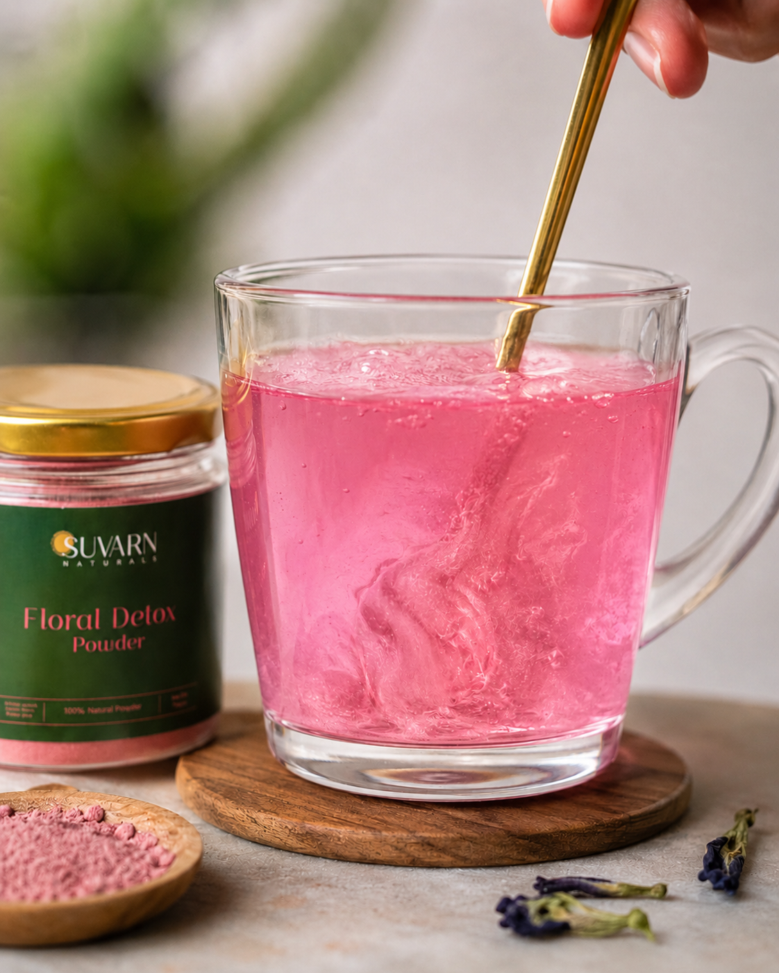 Floral detox powder dissolving in warm water, blue to violet color change